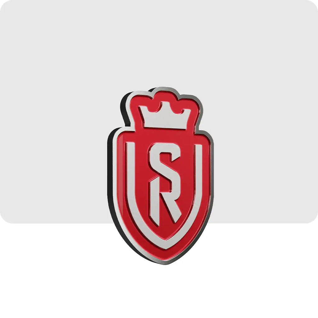 Pin's personnalisé de couleur gris et rouge en forme du blason de l'équipe de football du stade de Reims. 